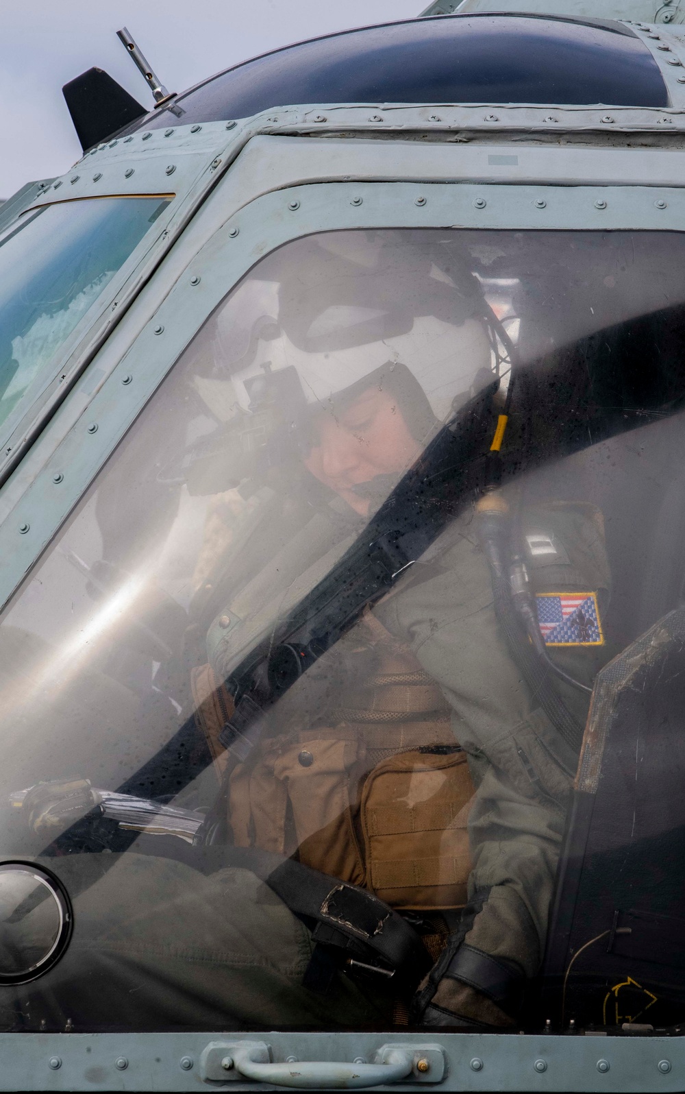 Sailors assigned to (HSC) 4 prepare for flight in an MH-60S Sea Hawk