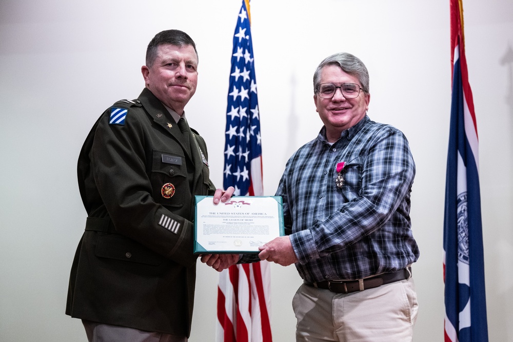 Wyoming Army Guard presents legion of merit to CW5 Doug Drost and John Fisher