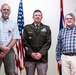 Wyoming Army Guard presents legion of merit to CW5 Doug Drost and John Fisher