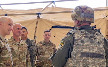 U.S. Air Force Chief of Staff Gen. David Allvin, Chief Master Sgt. of the Air Force David Flosi and U.S. Air Force Col. Keagan McLeese, 9th Reconnaissance Wing commander, speak with Airmen participating in Exercise Bamboo Eagle 24-3