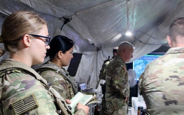 Advisors listen to a Battle Update Brief