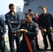 ATLANTIC OCEAN (Aug. 1, 2024) Damage Control Petty Officer 2nd Class Nicolas Quidachay teaches a Damage Control Academy class how to handle a firefighting hose during Composite Training Unit Exercise (COMPTUEX)