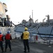 ATLANTIC OCEAN (Aug. 1, 2024) Sailors assigned to the Arleigh Burke-class guided-missile destroyer USS Jason Dunham (DDG 109), pay out slack on the messenger line while doing a replenishment-at-sea.