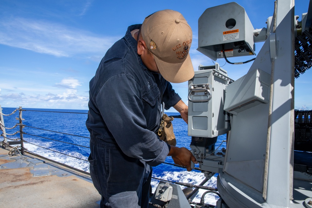 O’Kane sailor conduct maintenance on an MK 38