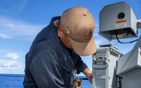 O’Kane sailor conduct maintenance on an MK 38