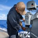 O’Kane sailor conduct maintenance on an MK 38
