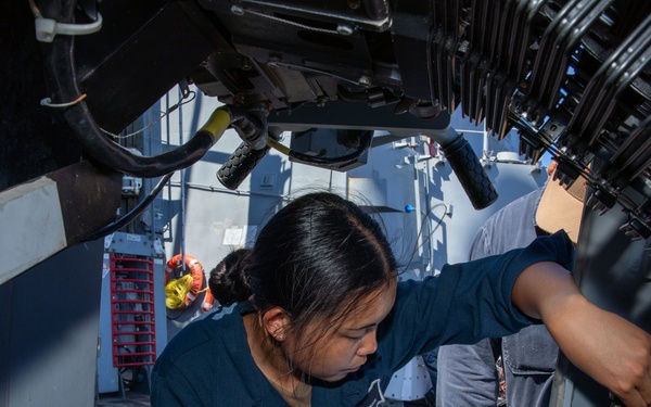 O’Kane sailor conduct maintenance on an MK 38