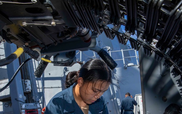 O’Kane sailor conduct maintenance on an MK 38