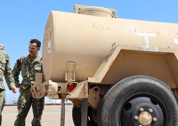 Navy Corpsman aids Army during joint field training exercise.