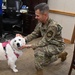 Maj. Gen. Larry Broadwell, 16th Air Force (AFCYBER) deputy commander, is introduced to 16th Air Force’s therapy dog “Bindi Lou.”