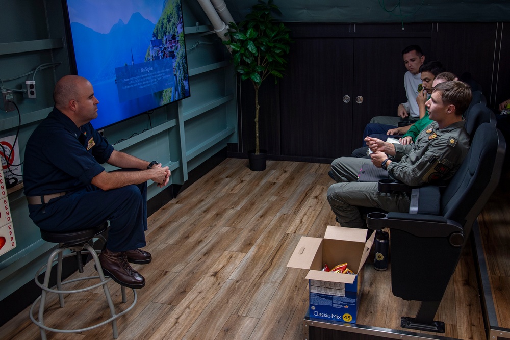 Sailors participate in a bible study aboard Abraham Lincoln