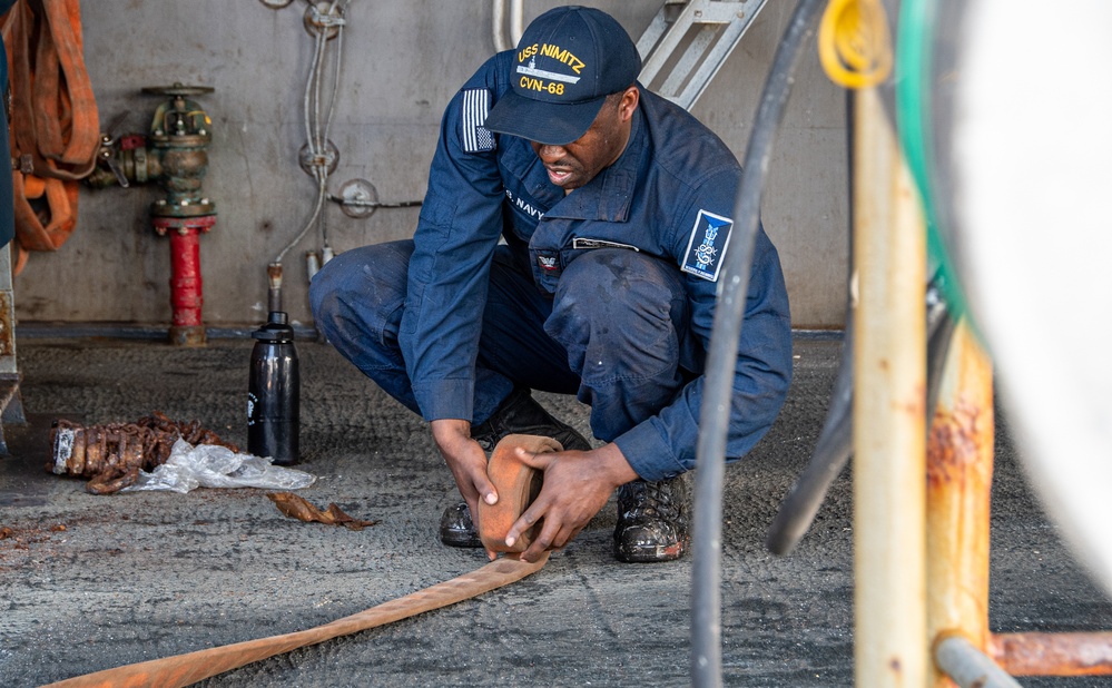 Nimitz Sailors Conduct Hydrostatic Testing On Fire Hoses Nimitz Sailors Conduct Hydrostatic Testing On Fire Hoses