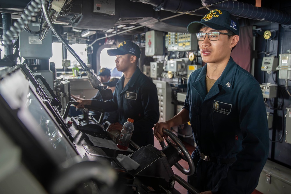 USS Spruance Sailor stands watch