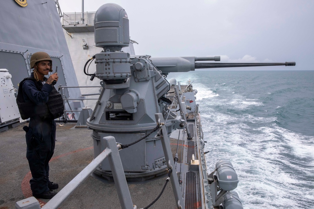 USS Spruance Sailor stands watch