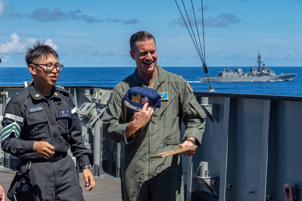 USS Blue Ridge Participates in a Sailor Transfer with the Japanese Maritime Self-Defense Force During Passing Exercise