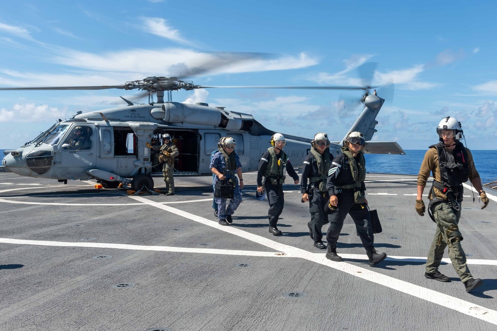 USS Blue Ridge Participates in a Sailor Transfer with the Japanese Maritime Self-Defense Force During Passing Exercise