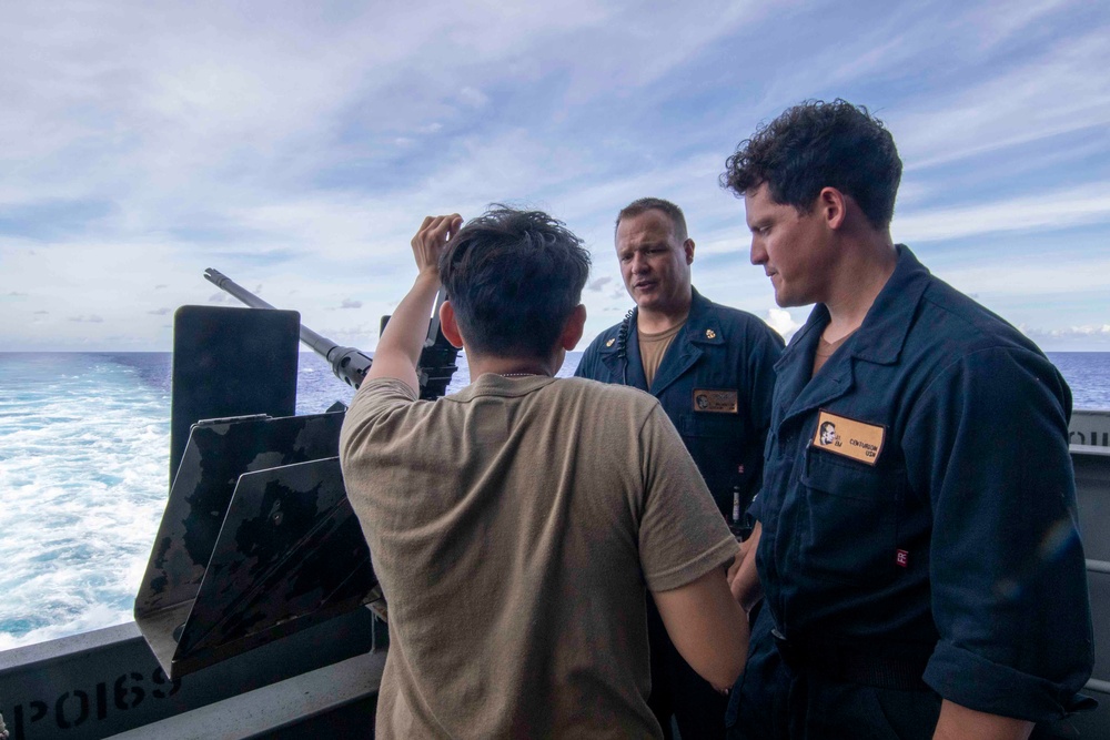 Sailors conduct training on a M2A1 .50 caliber machine gun aboard Abraham Lincoln