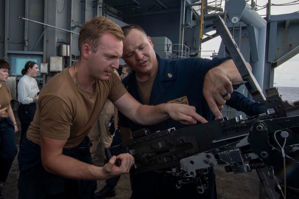 Sailors conduct training on a M2A1 .50 caliber machine gun aboard Abraham Lincoln