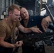 Sailors conduct training on a M2A1 .50 caliber machine gun aboard Abraham Lincoln