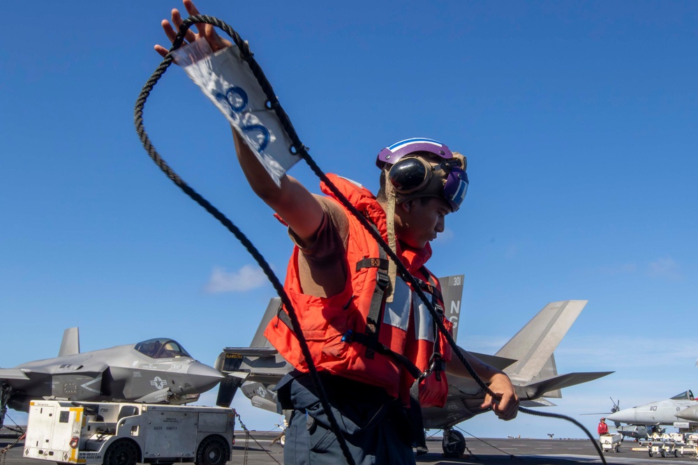Abraham Lincoln conducts a replenishment-at-sea (RAS)