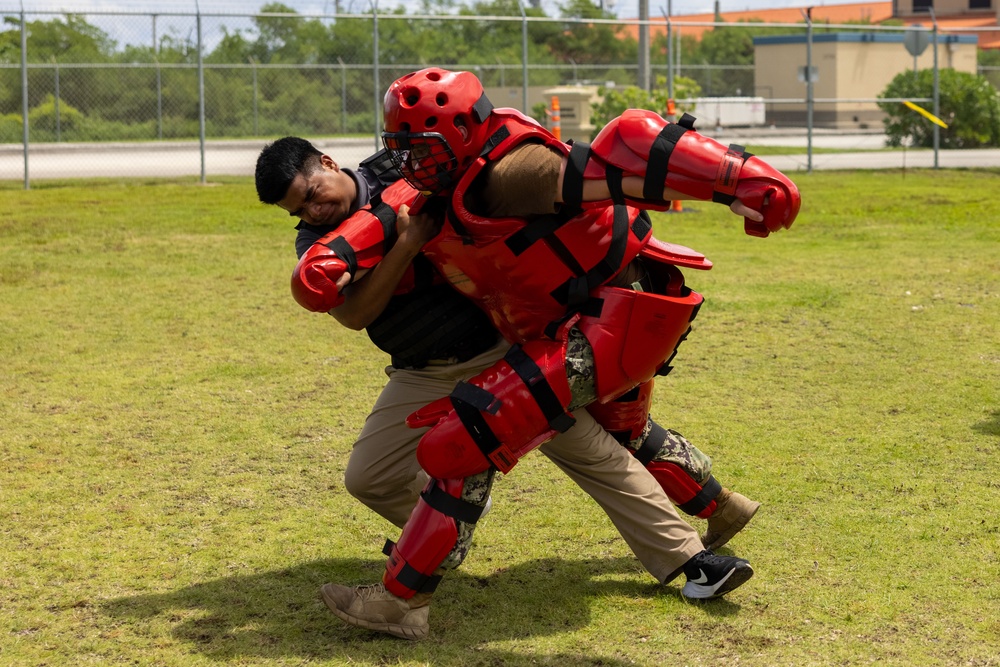 Military police Marines and civilians participate in the OC course