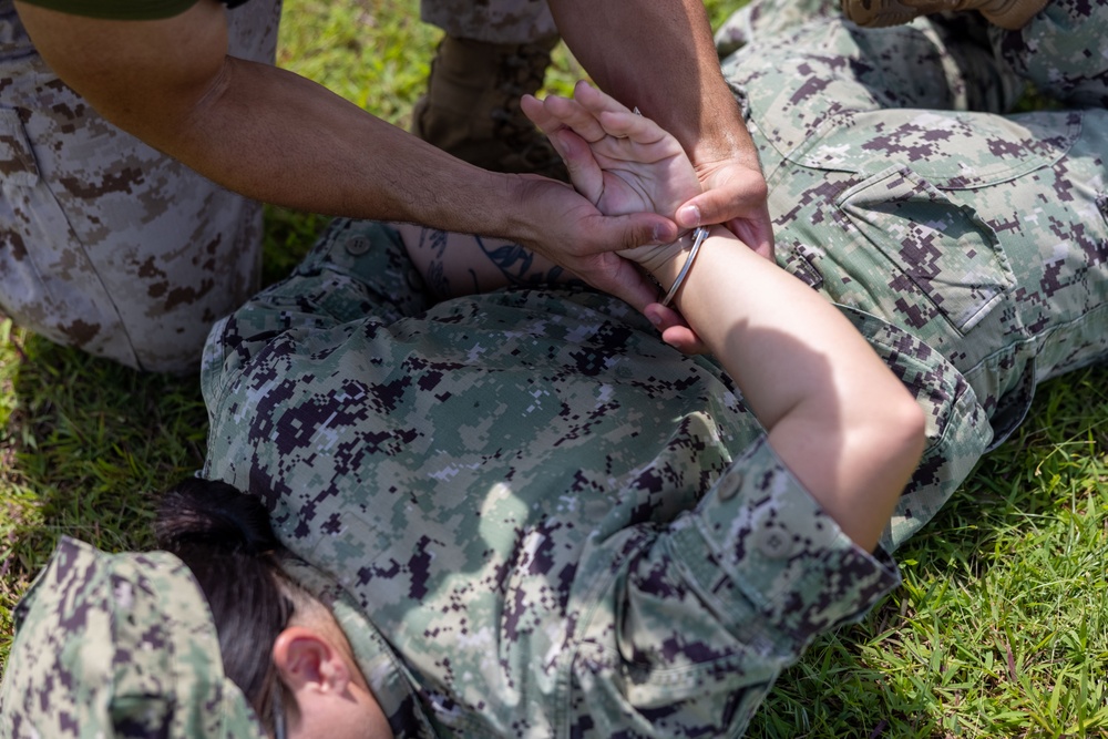 Military police Marines and civilians participate in the OC course
