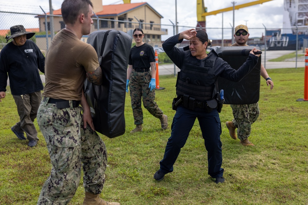 Military police Marines and civilians participate in the OC course