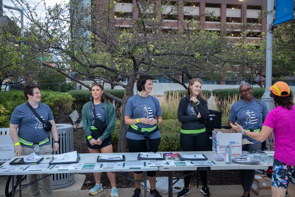 Members of EANGUS assist runners before the their 5K Fun Run at the Detroit Riverwalk