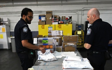 CBP K9 Handlers search for counterfeit pharmaceuticals at JFK