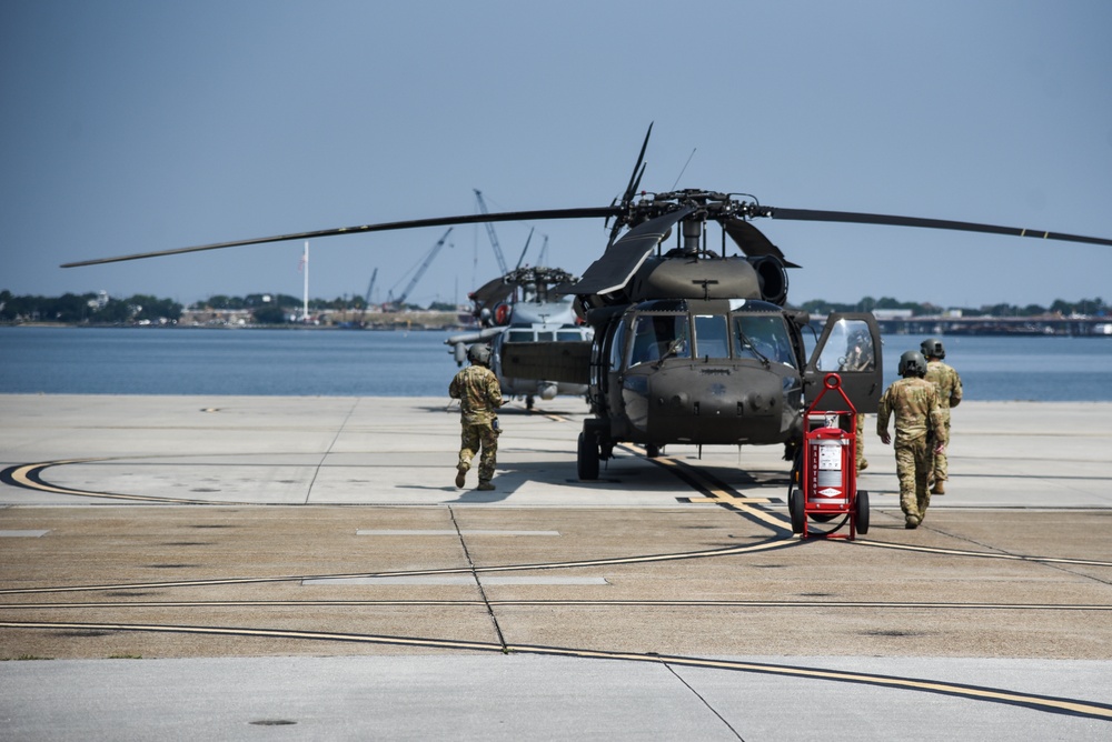 Virginia National Guard flight crews join flyover honoring U.S. Navy Vietnam veteran