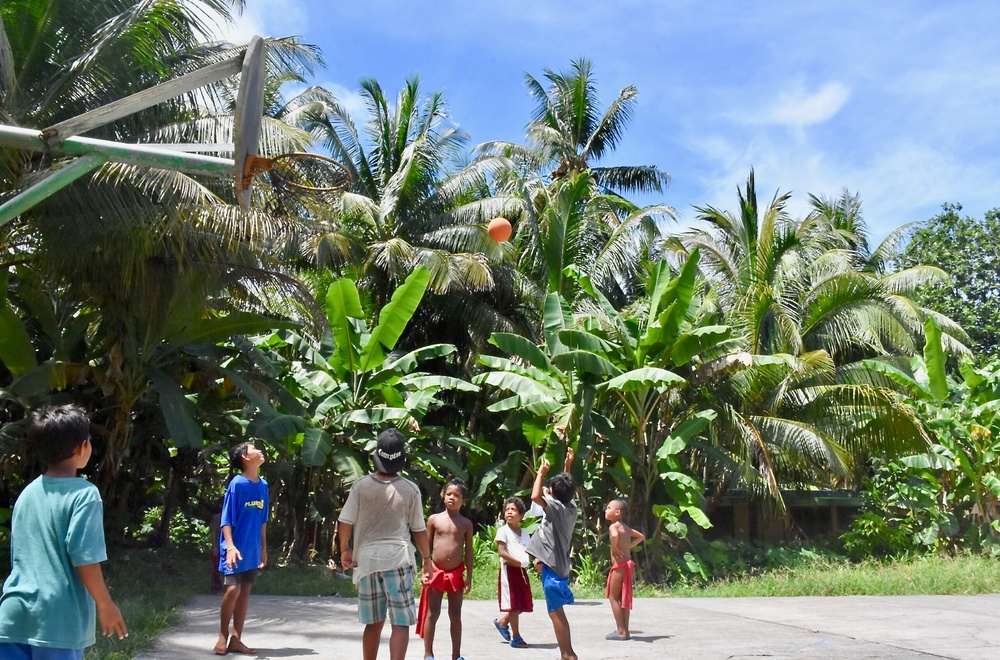 U.S. Coast Guard visits with residents of Satawal Atoll, FSM, following rescue