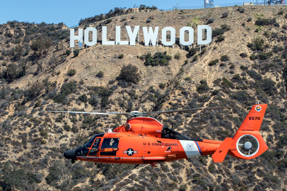 U.S. Coast Guard Dolphin Flies by Hollywood Icon