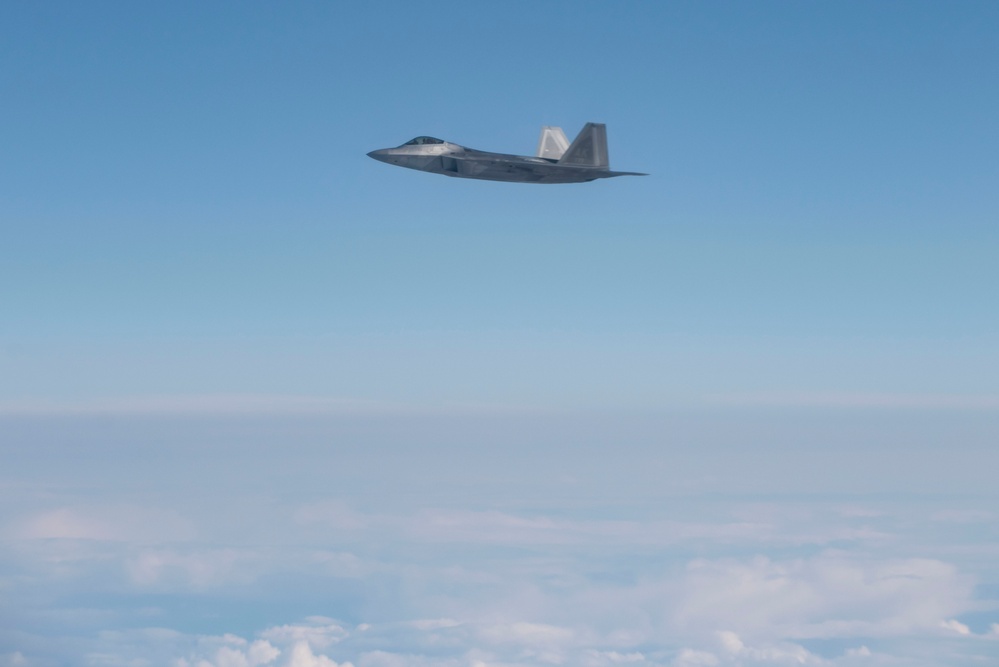 Alaska F-22s and F-35s refuel from a KC-46 during RF-A 24-3