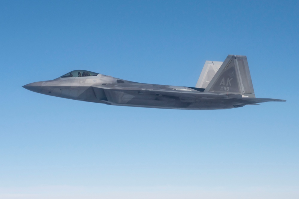 Alaska F-22s and F-35s refuel from a KC-46 during RF-A 24-3