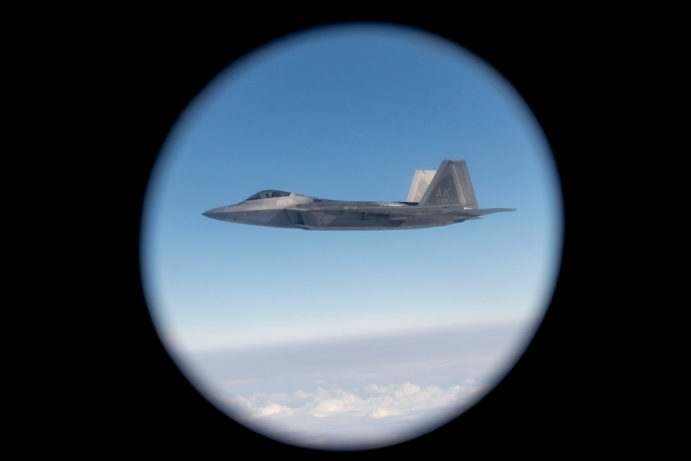 Alaska F-22s and F-35s refuel from a KC-46 during RF-A 24-3