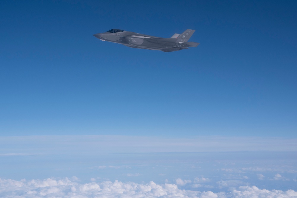 Alaska F-22s and F-35s refuel from a KC-46 during RF-A 24-3