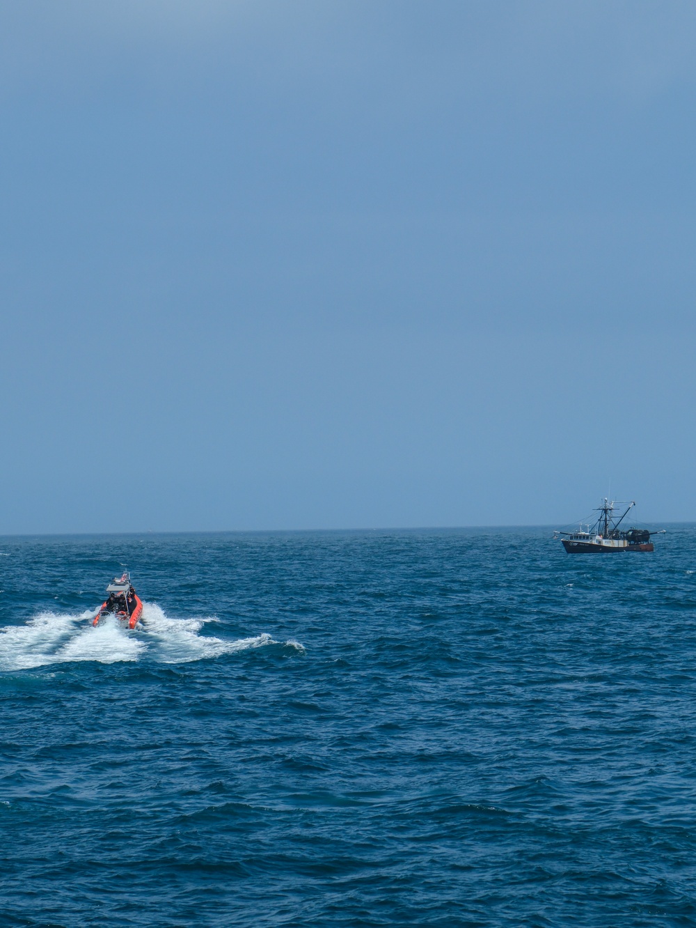 Coast Guard Cutter Northland personnel conduct fisheries boarding in the Atlantic Ocean