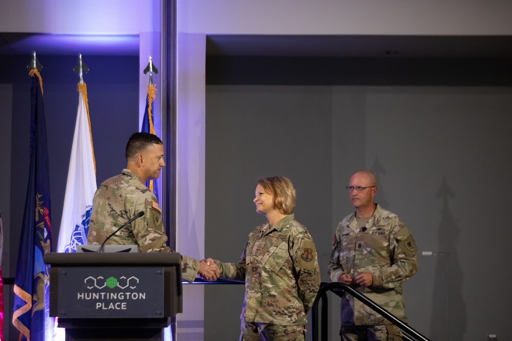 Brig. Gen. Wagh presents Chief Master Sgt. Balabuch with a state coin during the Joint Enlisted Leadership Conference in Detroit, MI