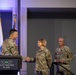 Brig. Gen. Wagh presents Chief Master Sgt. Balabuch with a state coin during the Joint Enlisted Leadership Conference in Detroit, MI