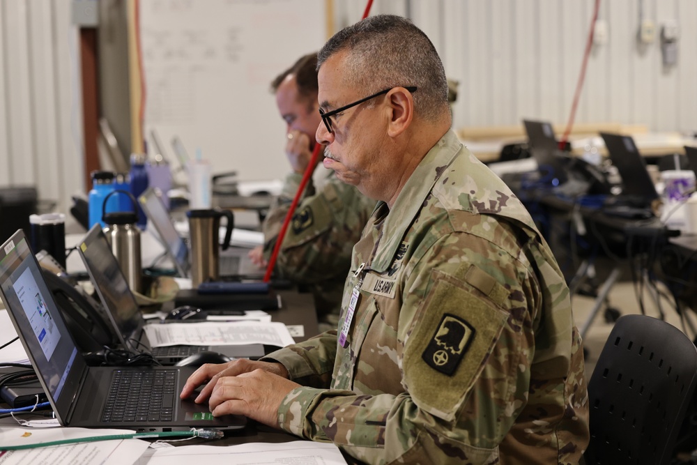 Sgt. Maj. Oscar Dubon monitors battle information