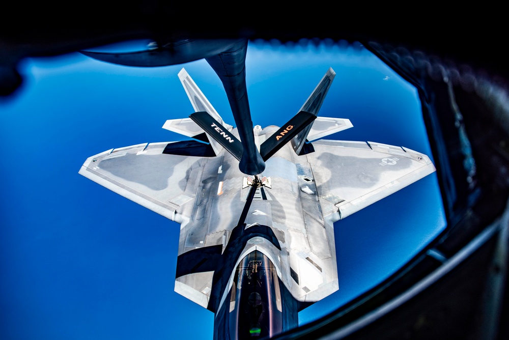 KC-135 Stratotanker refueling F-22 Raptors