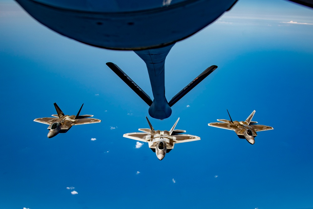 KC-135 Stratotanker refueling F-22 Raptors