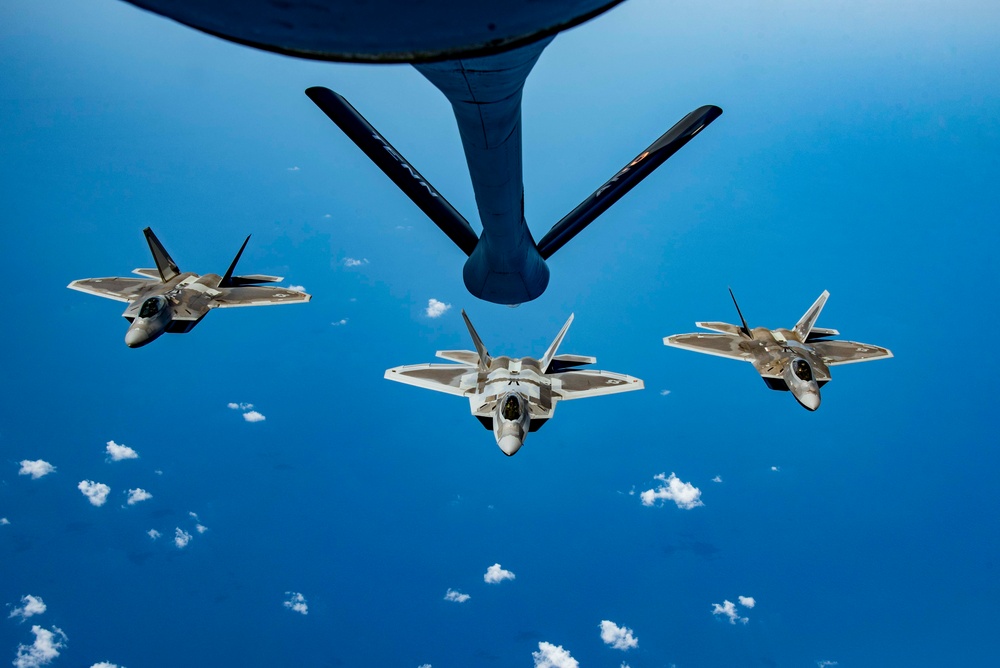 KC-135 Stratotanker refueling F-22 Raptors