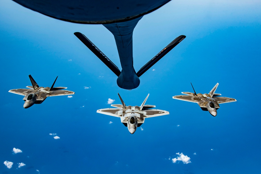 KC-135 Stratotanker refueling F-22 Raptors