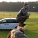 Marines with Marine Corps Combat Service Support Schools maneuver through an obstacle course