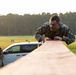 Marines with Marine Corps Combat Service Support Schools maneuver through an obstacle course