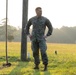 Marines with Marine Corps Combat Service Support Schools maneuver through an obstacle course