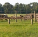 Marines with Marine Corps Combat Service Support Schools maneuver through an obstacle course