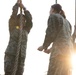 Marines with Marine Corps Combat Service Support Schools maneuver through an obstacle course