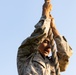 Marines with Marine Corps Combat Service Support Schools maneuver through an obstacle course